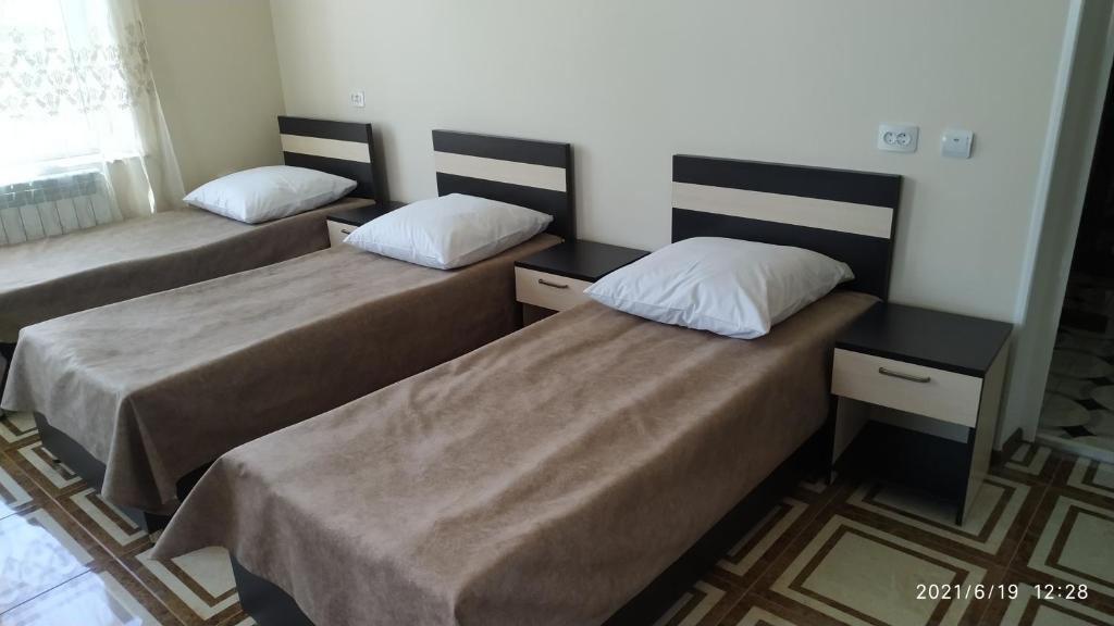 Postel nebo postele na pokoji v ubytování Erazank Hotel