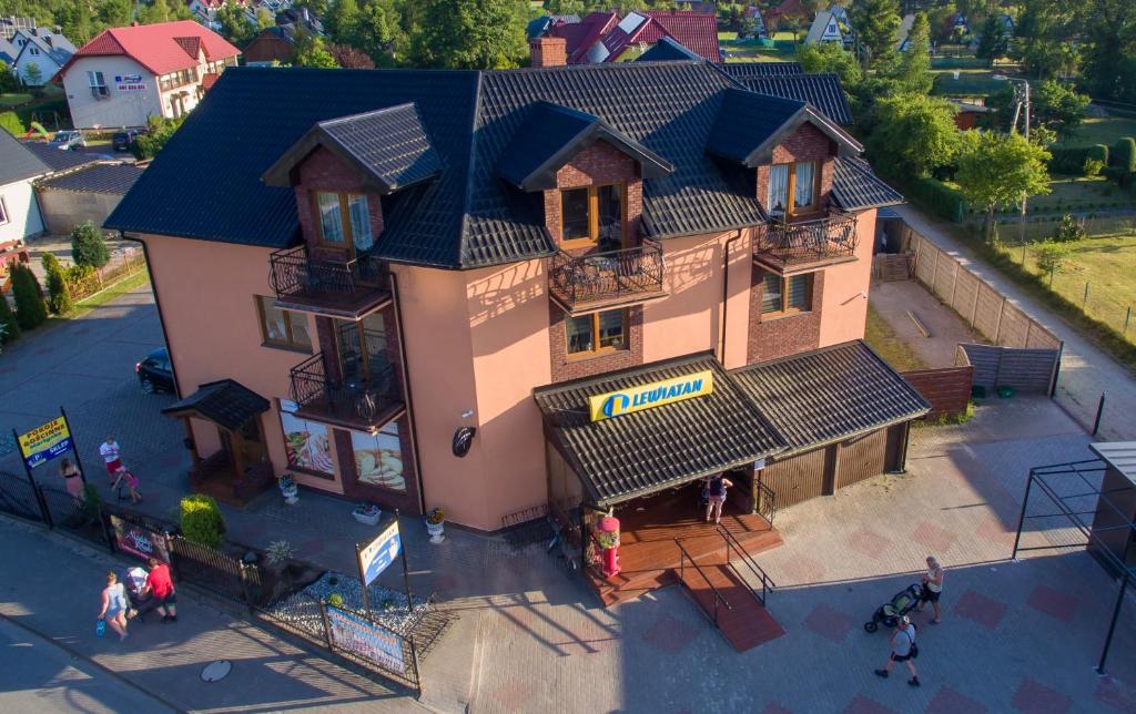 an overhead view of a building with people standing outside at Pokoje Gościnne Martynka in Białogóra