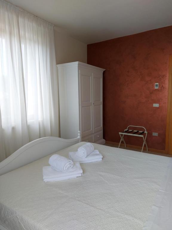 Postel nebo postele na pokoji v ubytování Hotel Valbella