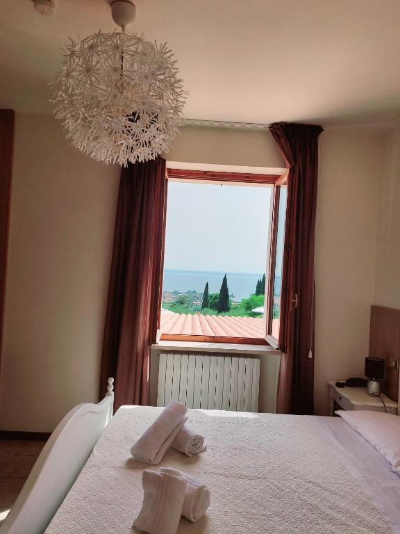 Postel nebo postele na pokoji v ubytování Hotel Valbella