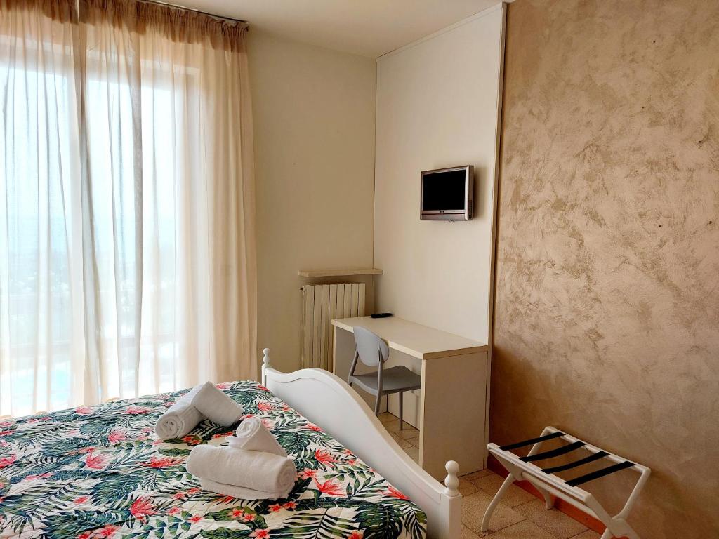 Postel nebo postele na pokoji v ubytování Hotel Valbella