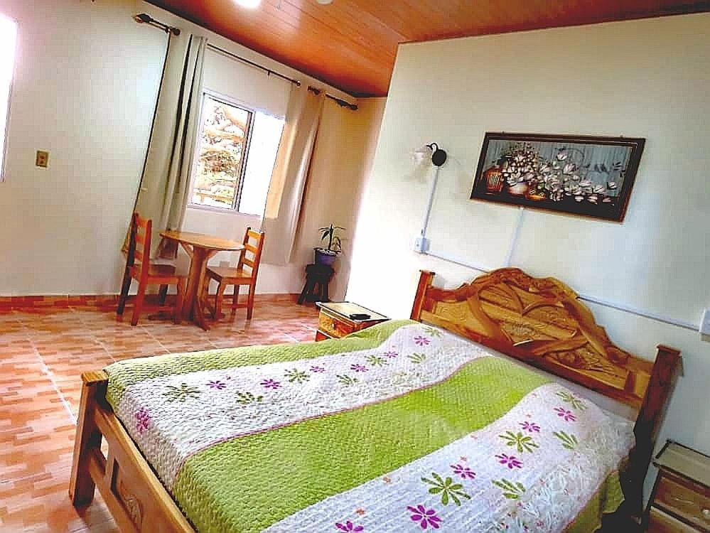 Postel nebo postele na pokoji v ubytování Cabañas Brisas Alto Boquete
