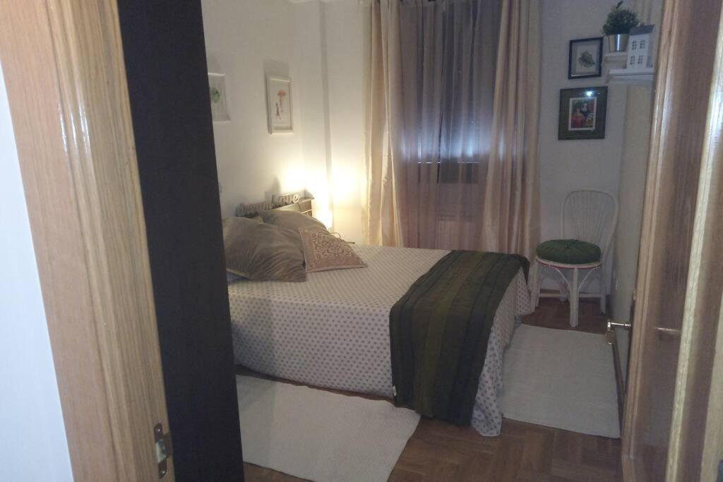 Postel nebo postele na pokoji v ubytování El pisito de Rodrigo II (alta en turismo VUT/2115)