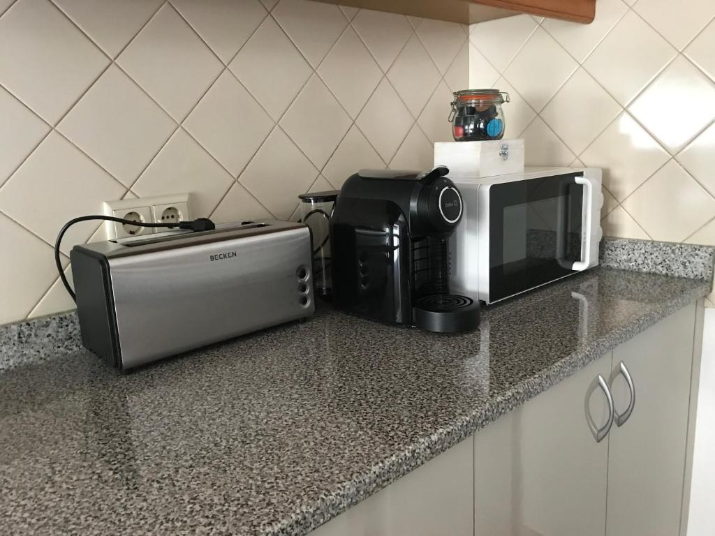 Kuchyň nebo kuchyňský kout v ubytování Casa da Aldeia
