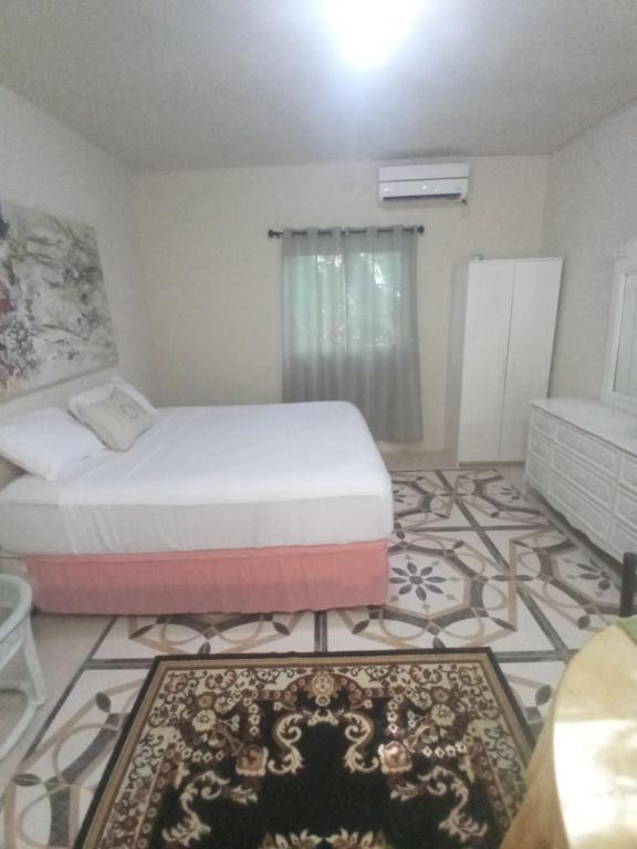 Postel nebo postele na pokoji v ubytování Grace Garden Guesthouse by Eminence Ent