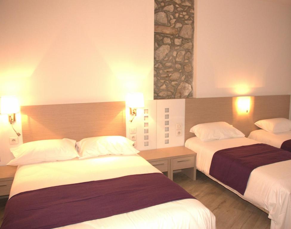 Postel nebo postele na pokoji v ubytování Hôtel Terranostra