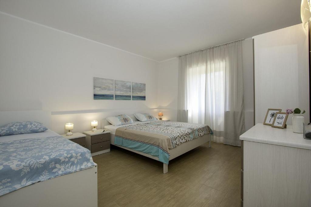 Postel nebo postele na pokoji v ubytování Apartments Istra Croatia