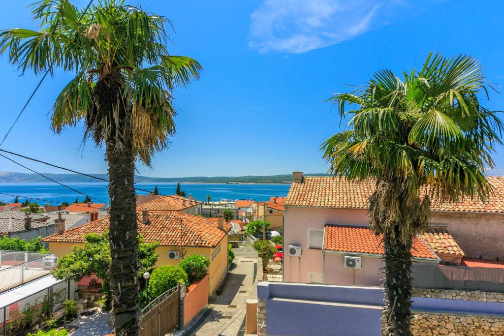 a view of a city with palm trees at House Tinac in Crikvenica