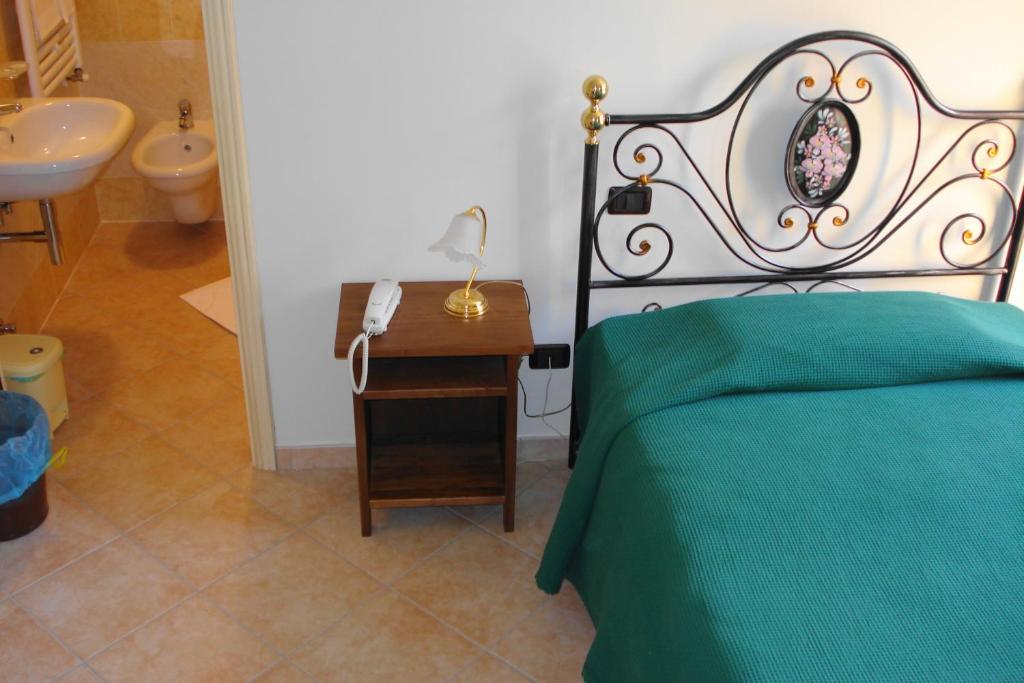 Posteľ alebo postele v izbe v ubytovaní Albergo La Casa Nel Bosco