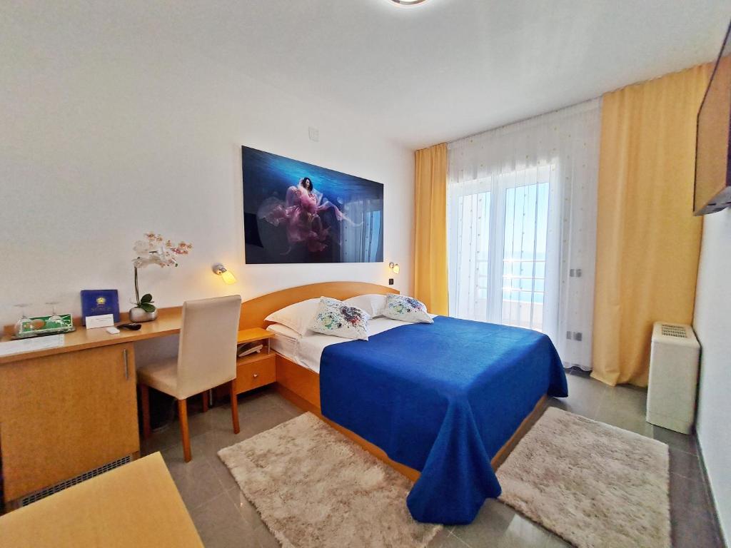 Postel nebo postele na pokoji v ubytování Hotel Sunce