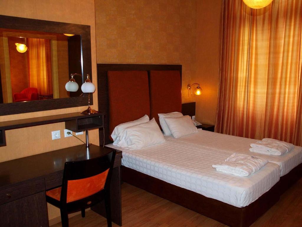 Letto o letti in una camera di Delphi Art Hotel by Prima Hotels