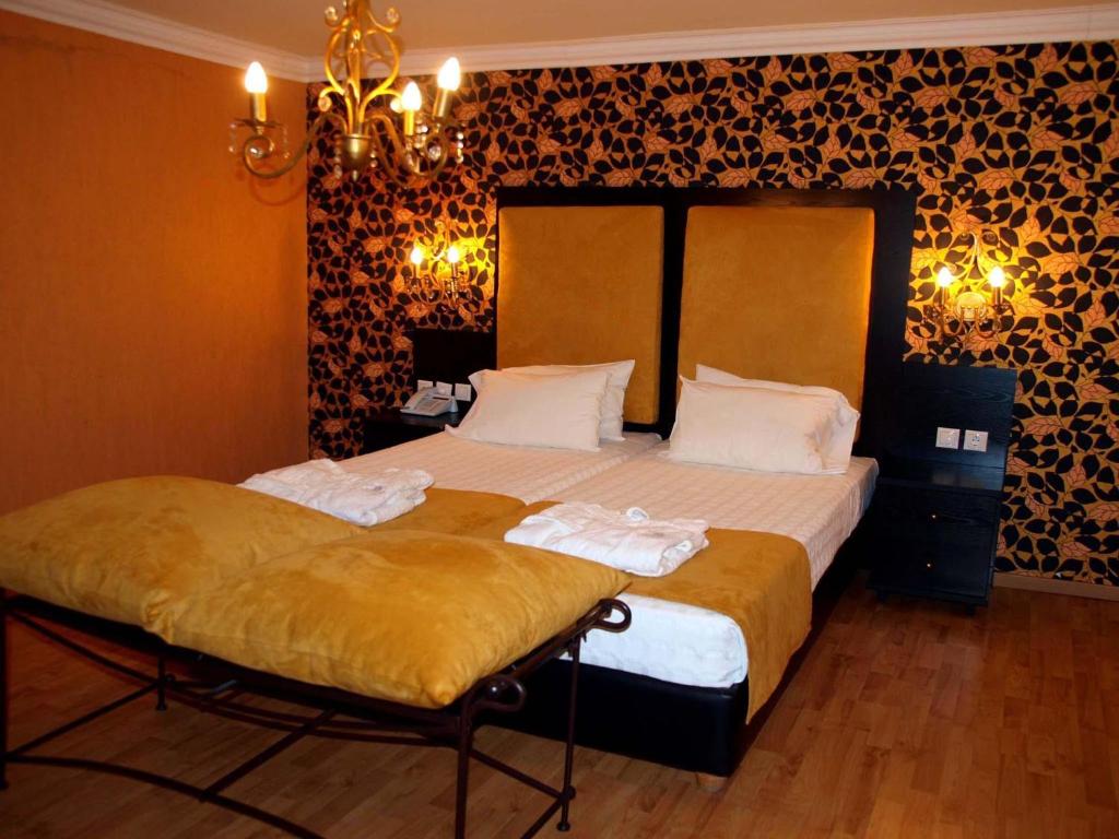 Letto o letti in una camera di Delphi Art Hotel by Prima Hotels