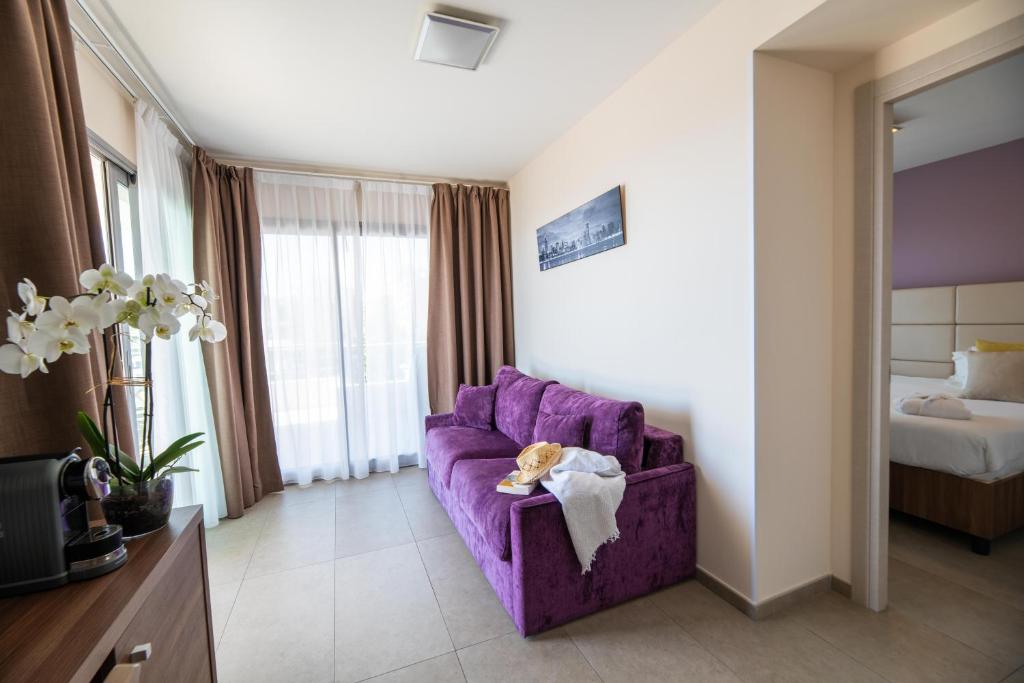Postel nebo postele na pokoji v ubytování Hotel Port Toga