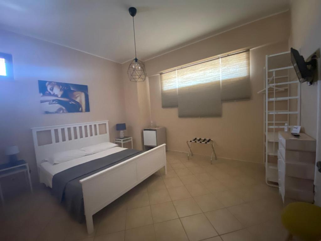 A bed or beds in a room at Le Camere di Rosanna