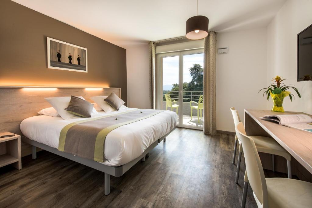Ένα ή περισσότερα κρεβάτια σε δωμάτιο στο Hotel du Grand Parc
