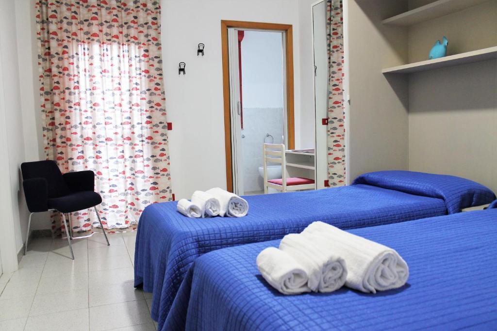 Postel nebo postele na pokoji v ubytování Hotel Villa Susy