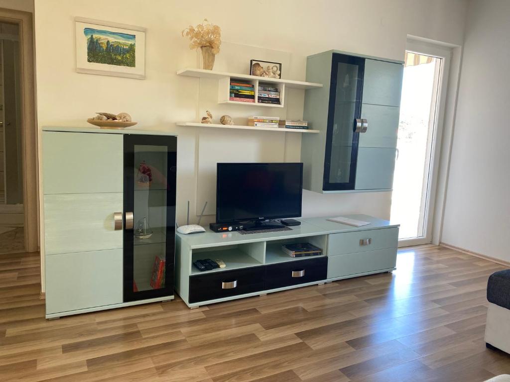 Telewizja i/lub zestaw kina domowego w obiekcie Villa Laguna