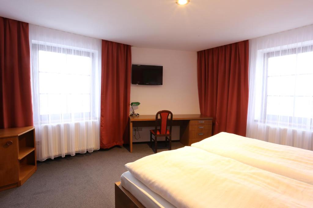 Postel nebo postele na pokoji v ubytování Hotel Hajčman