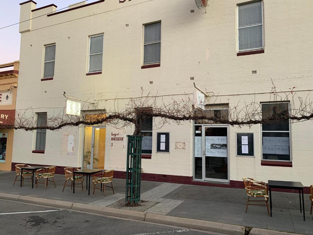 a building with tables and chairs in front of it at The Barkly Bistro Bar & Accommodation in Ararat