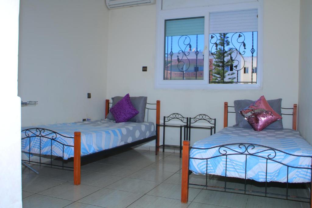 Voodi või voodid majutusasutuse Mohammedia appart piscines toas