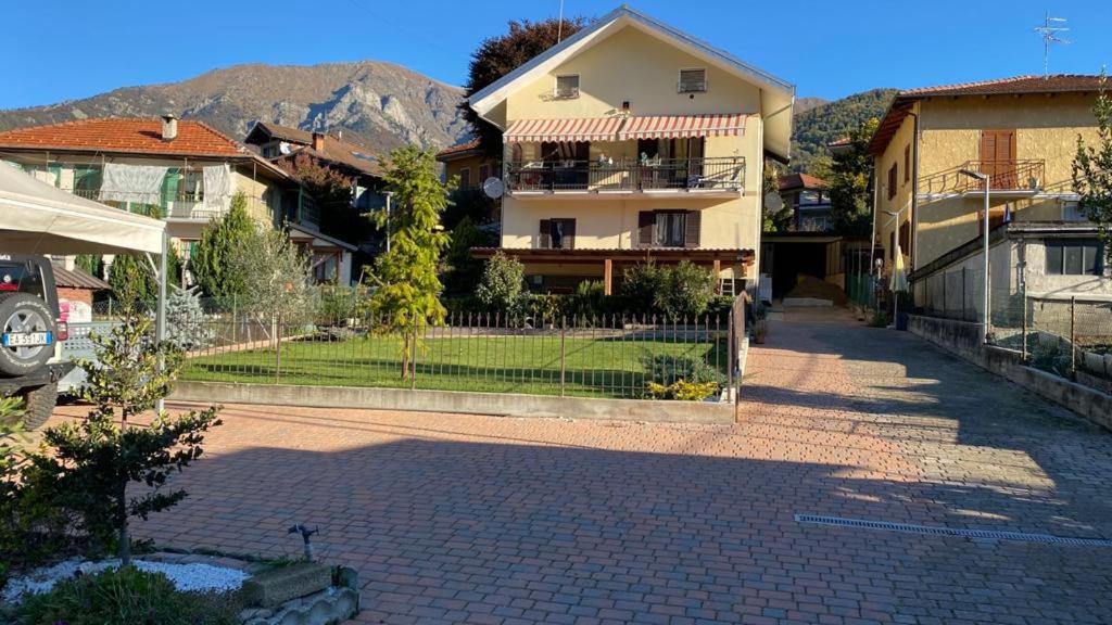 a street in a village with houses and a fence at La Ciuenda in Perosa Argentina