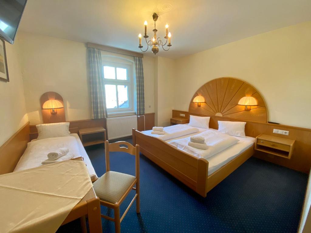 Postel nebo postele na pokoji v ubytování Hotel Gasthof Stenitzer