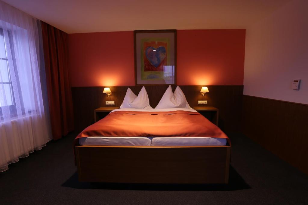 Postel nebo postele na pokoji v ubytování Hotel Hajčman