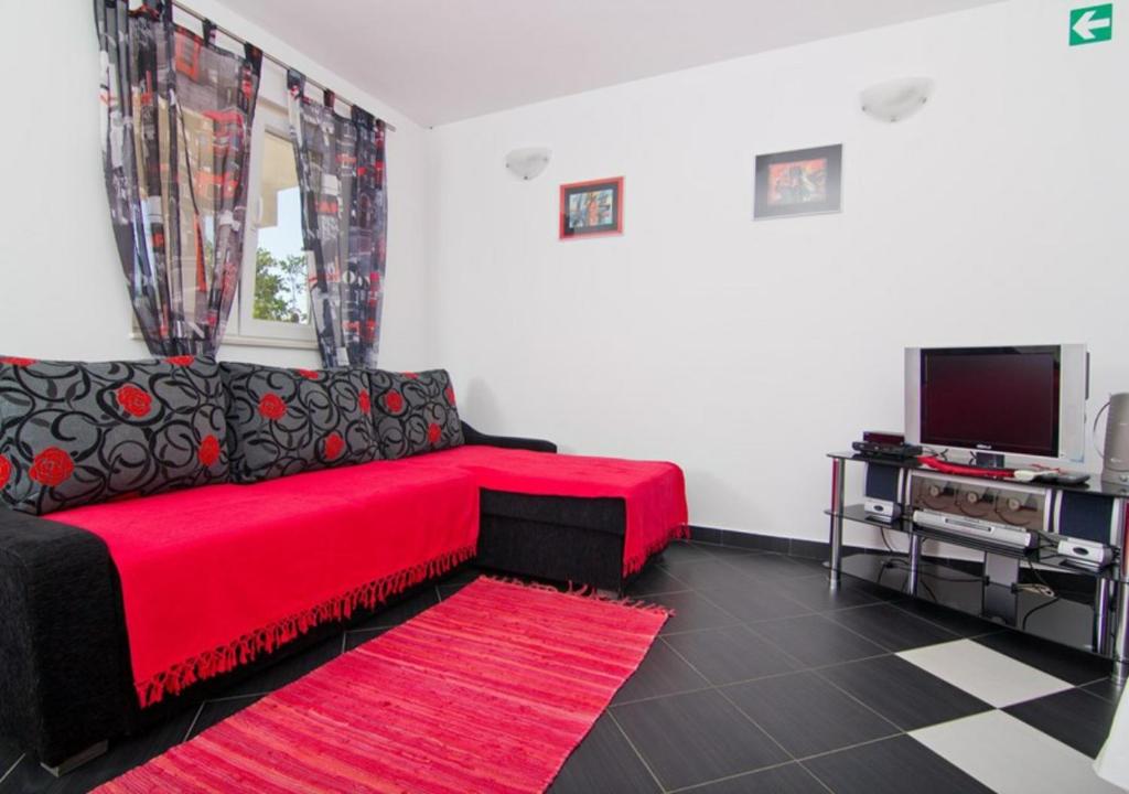 TV a/nebo společenská místnost v ubytování Apartment Maya 1