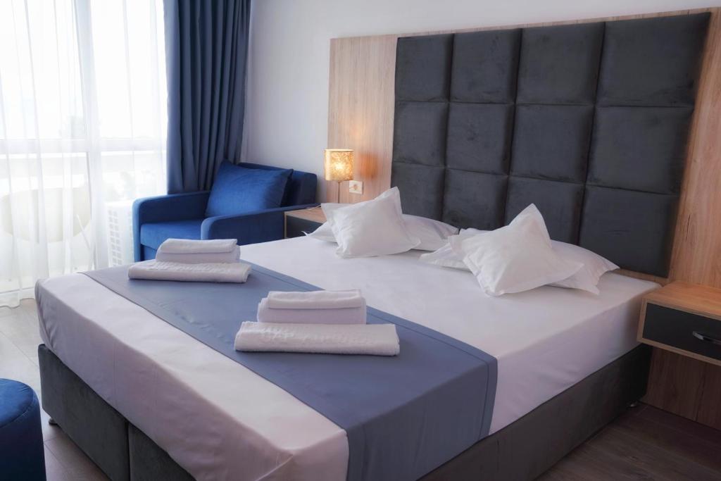 Postel nebo postele na pokoji v ubytování Hotel Opal