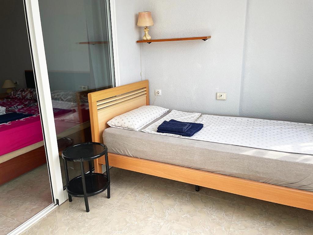 A bed or beds in a room at Apartament BAMBU N°2 przy plaży PIĘKNY WIDOK
