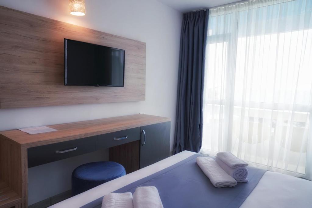 TV a/nebo společenská místnost v ubytování Hotel Opal