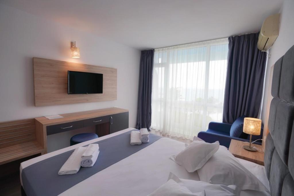 Postel nebo postele na pokoji v ubytování Hotel Opal