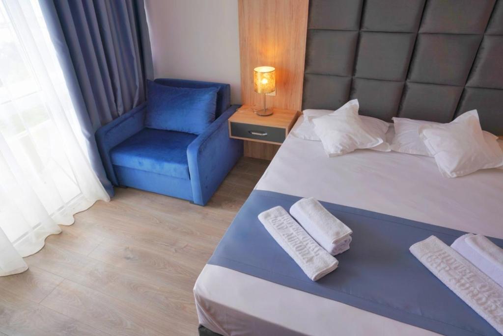 Postel nebo postele na pokoji v ubytování Hotel Opal