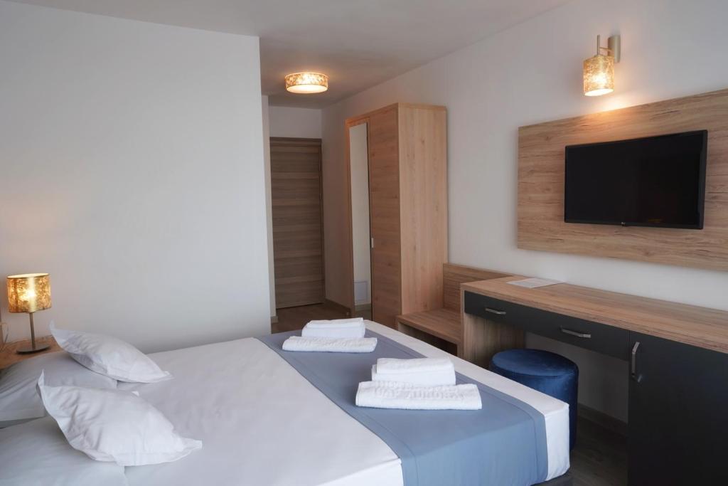 Postel nebo postele na pokoji v ubytování Hotel Opal