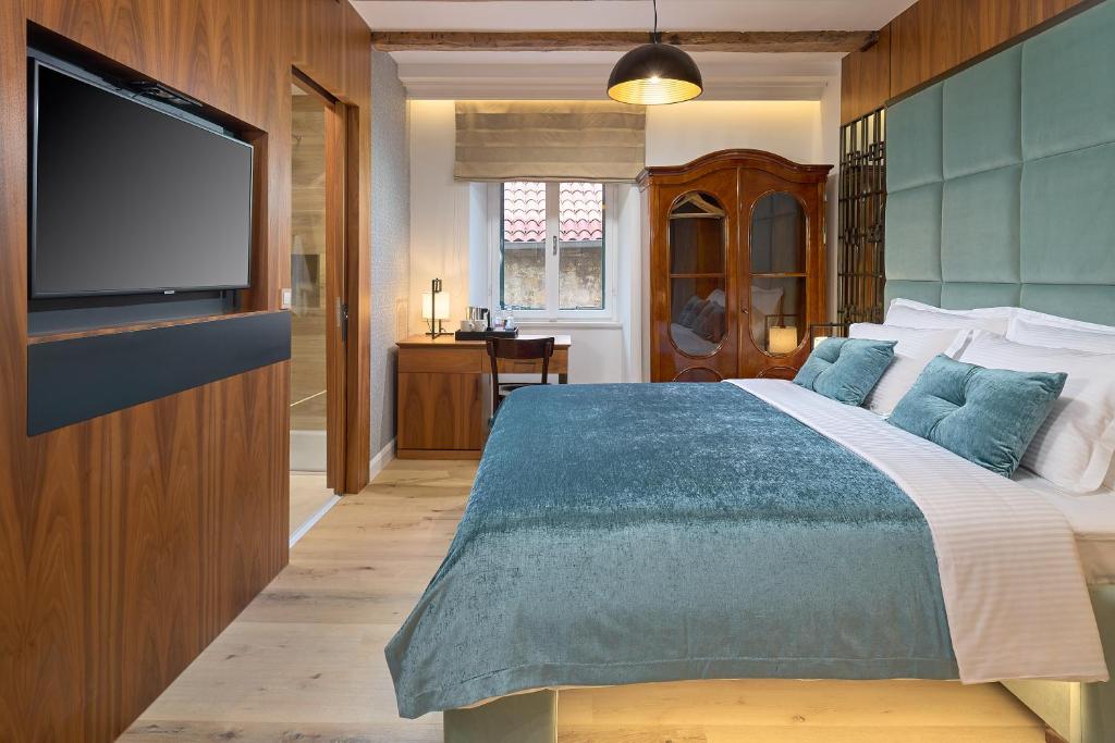 Postel nebo postele na pokoji v ubytování Geremia Luxury Rooms