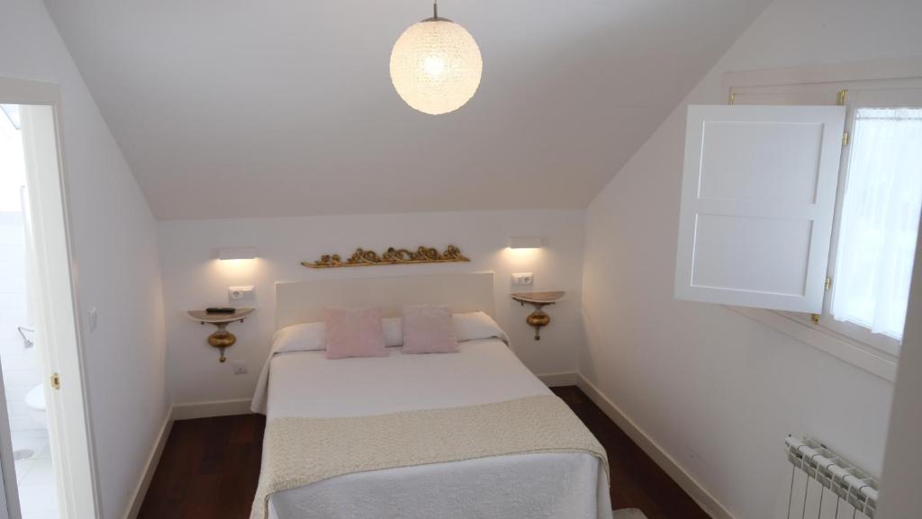 Postel nebo postele na pokoji v ubytování HOTEL LA CASA DE LAS CAMELIAS