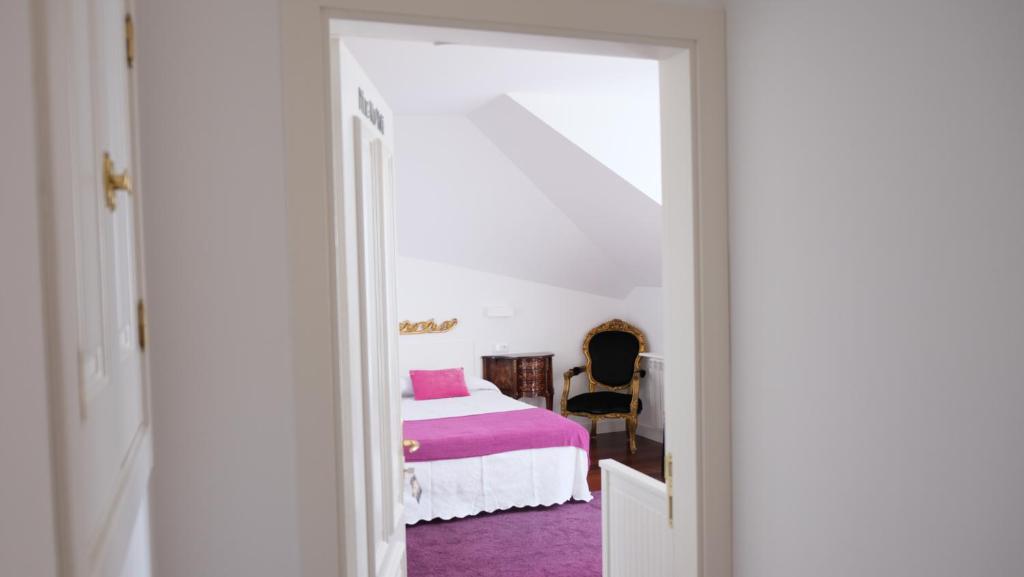 Postel nebo postele na pokoji v ubytování HOTEL LA CASA DE LAS CAMELIAS