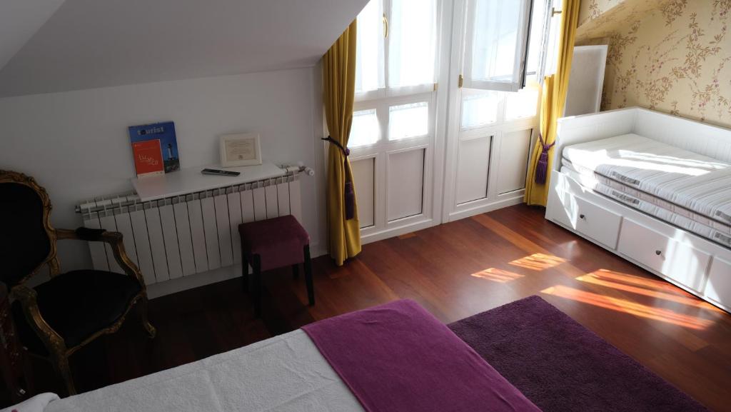Postel nebo postele na pokoji v ubytování HOTEL LA CASA DE LAS CAMELIAS