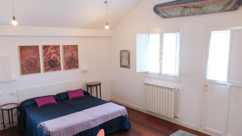 Postel nebo postele na pokoji v ubytování HOTEL LA CASA DE LAS CAMELIAS