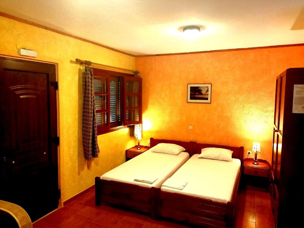 Postel nebo postele na pokoji v ubytování Sunrise Apartments