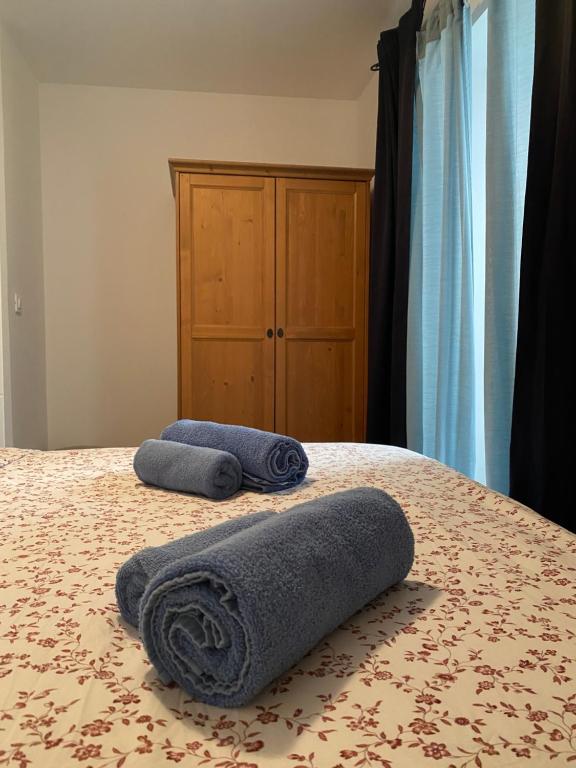 Posteľ alebo postele v izbe v ubytovaní Apartman Volosko