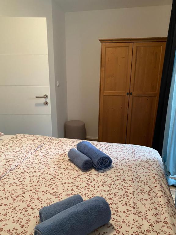 Posteľ alebo postele v izbe v ubytovaní Apartman Volosko