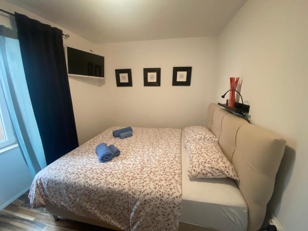 Posteľ alebo postele v izbe v ubytovaní Apartman Volosko