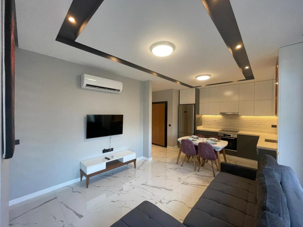 TV a/nebo společenská místnost v ubytování Square Light Residence