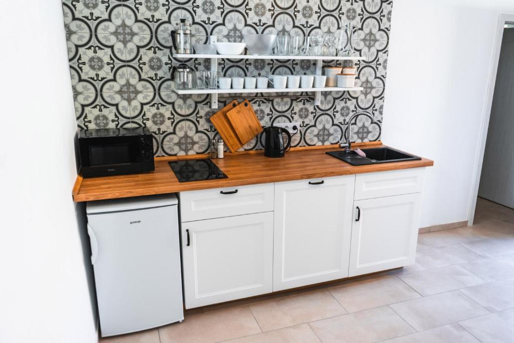 Kuchyň nebo kuchyňský kout v ubytování Apartmány Pulgary