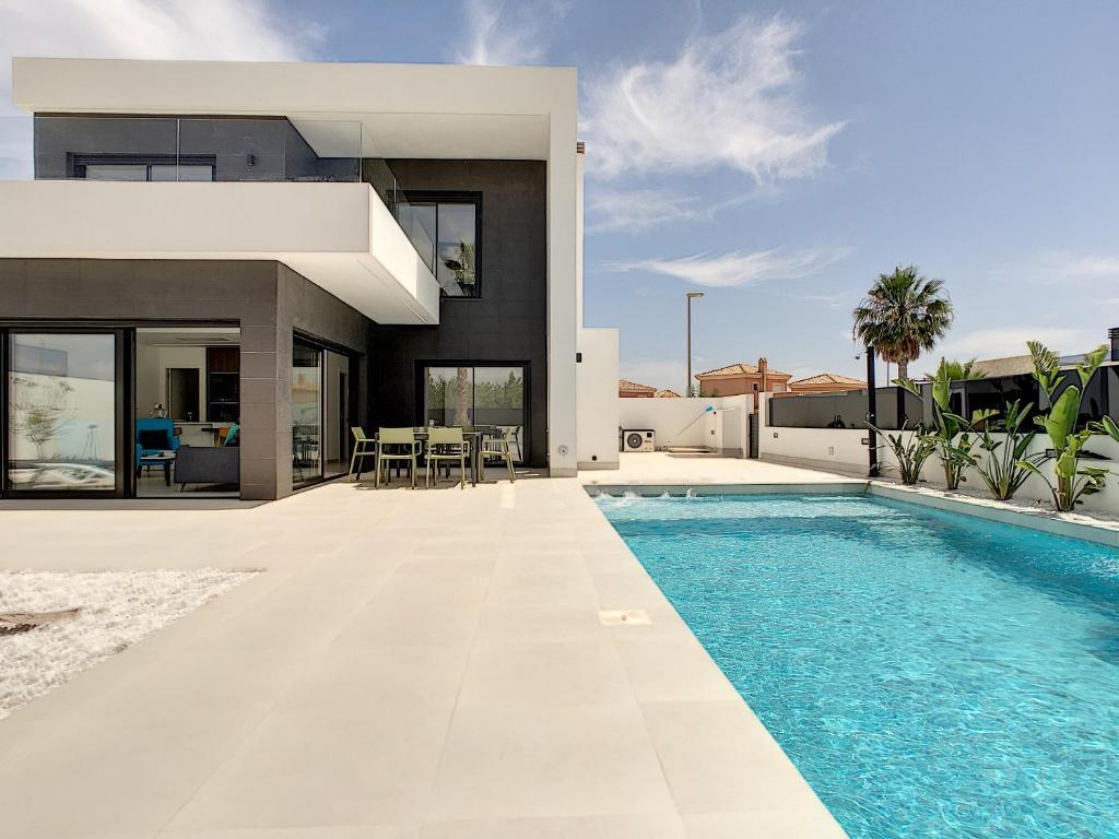 a villa with a swimming pool and a house at Villa sol - Sucina - 3909 in Sucina