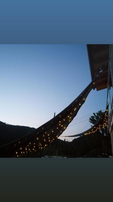 a string of lights hanging from a building at Douro Balcony in Resende