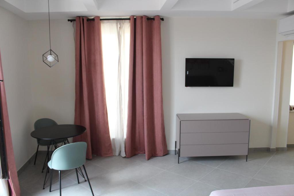 TV a/nebo společenská místnost v ubytování Margiò House
