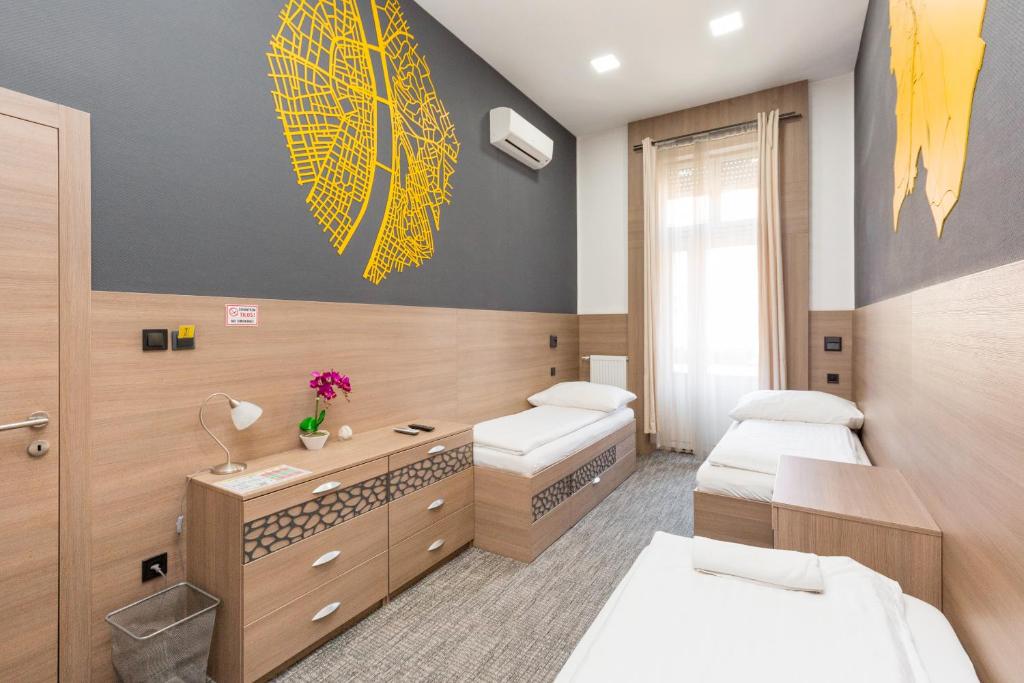 Posteľ alebo postele v izbe v ubytovaní E14 Design Hostel