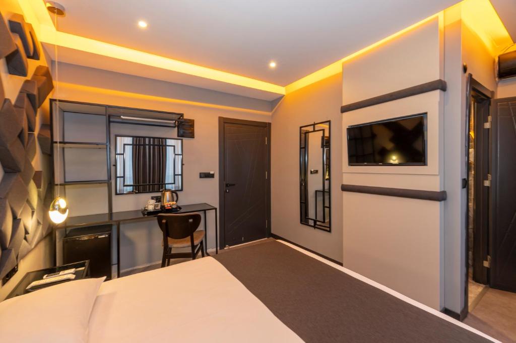 Postel nebo postele na pokoji v ubytování White Palace Hotel